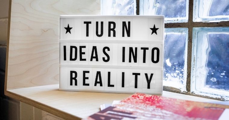 A light box displaying the text - turn ideas into reality