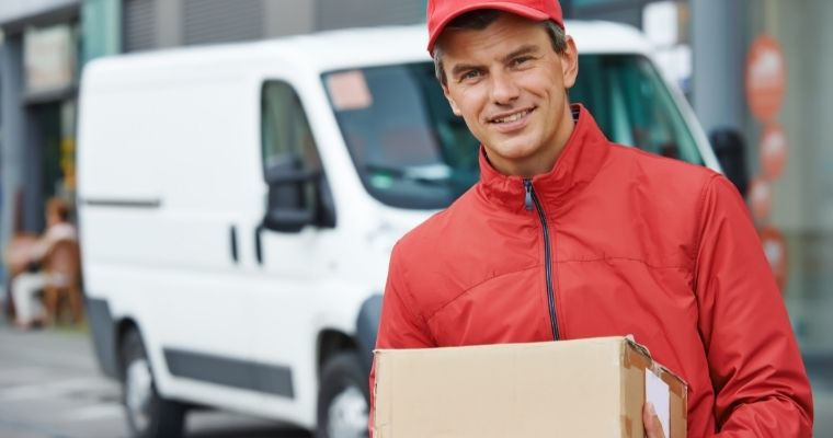 Delivery driver holding a parcel