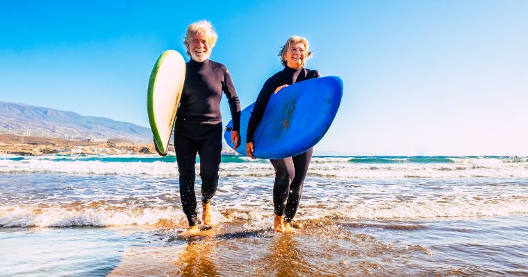 Elderly surfer couple