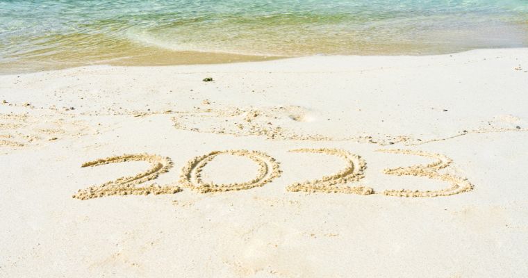 2023 written in the sand on a beach