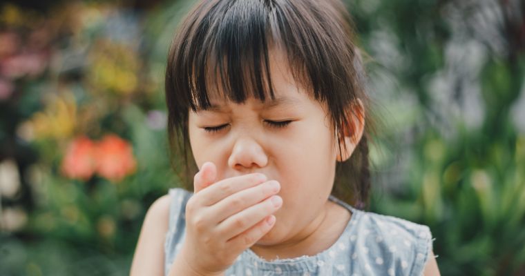 A young child coughing